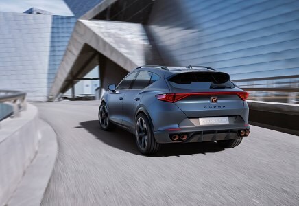 CUPRA CUV Formentor driving building view